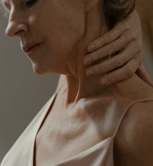 Close-up side view of a senior woman in a contemplative moment, highlighting grace and serenity.